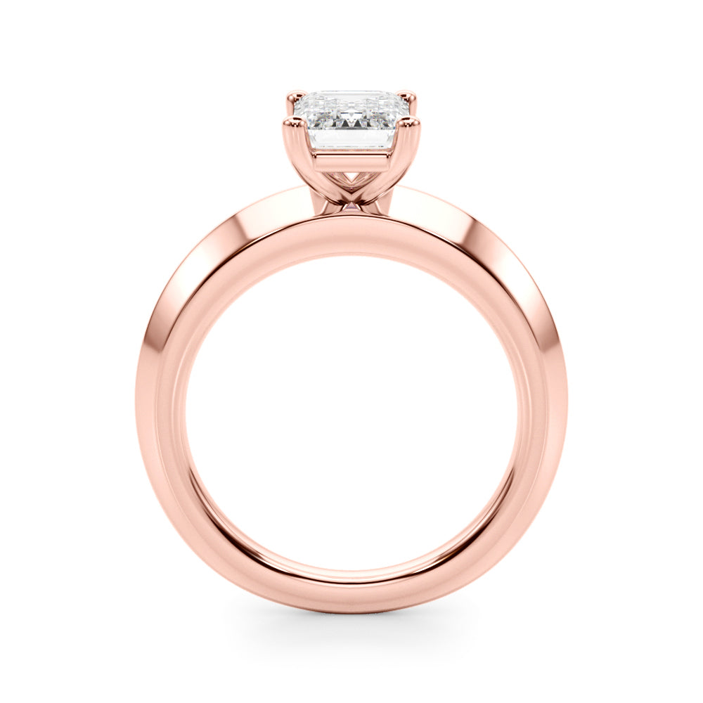 Detailed side angle perspective of rose gold ring showing the height and basket of the emerald cut diamond