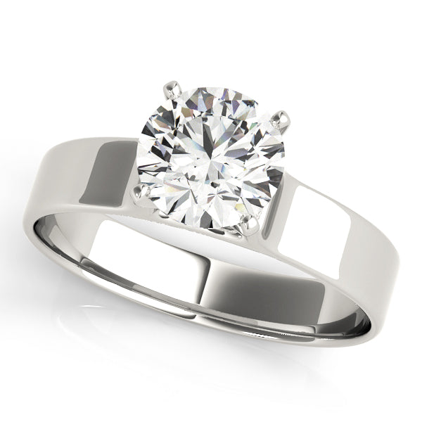 Fine jewelry round cut diamond solitaire ring with a flat wide band in 14K white gold, top view.