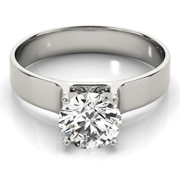 High-polished 14K white gold flat wide band solitaire ring featuring a 4-prong round center diamond.