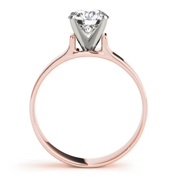 Clean side profile of a round diamond solitaire engagement ring with a flat shank in 14K rose gold.