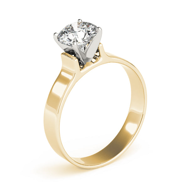 Round cut diamond solitaire engagement ring with a flat wide band in 14K yellow gold, perspective view.