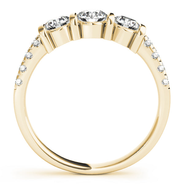 0.95Ct F-VS Lab-Grown Diamond Three-Stone Ring on finger, showcase of luxury sustainable diamond jewelry in yellow gold