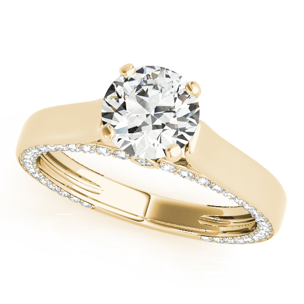 Angled view of a 14k yellow gold round solitaire ring with hidden diamonds along the side profile
