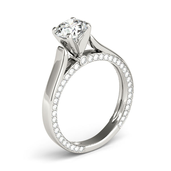 Side profile view of white gold engagement ring with delicate hidden pavé diamonds under the shank.