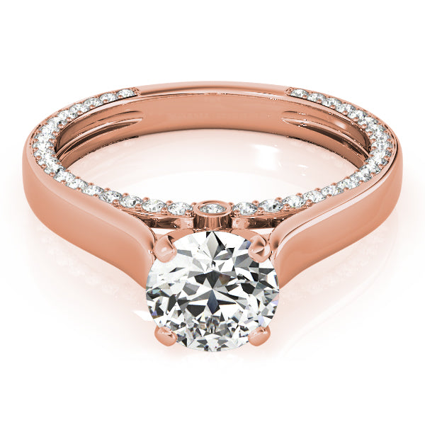 Angled front shot of a 14k rose gold round cut lab diamond engagement ring with a secret diamond rim.