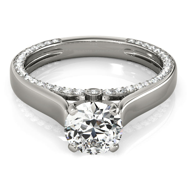 white gold round solitaire ring highlighting the cathedral arch and side accent stones from above.