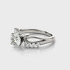 Creative perspective display showing the top and side curves of the 14K white gold diamond swirl ring.