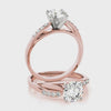 highlighting the sparkling pave accents and fluid split shank of the 14K rose gold diamond ring.