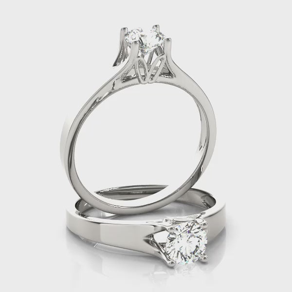 360-degree rotation video showing the sparkle of the lab diamond and the detailed infinity side profile in white gold.