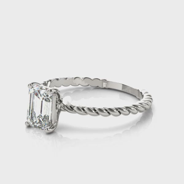 High-definition video of white gold emerald cut diamond solitaire ring