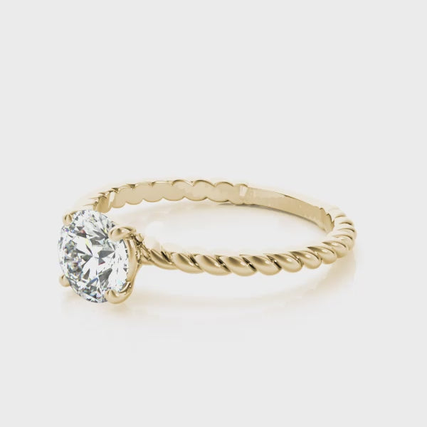 360-degree rotation video of a white gold bezel set round lab grown diamond engagement ring.