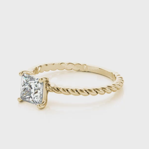 High-definition rotating display of 14k yellow gold braided rope shank princess cut solitaire ring