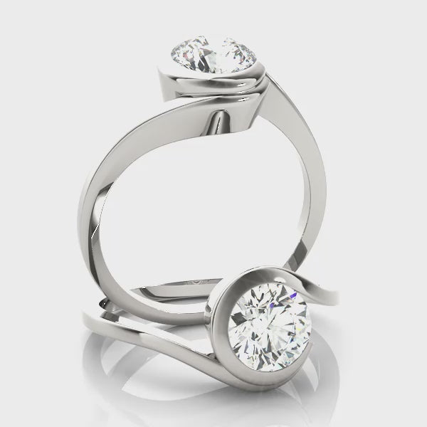 A 360-degree rotating video showing the elegant bypass bezel setting and the brilliance of the VS F lab-grown diamond in 14K gold.