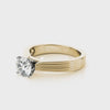 Fall in love with the unique grooved details of this gorgeous cathedral solitaire ring