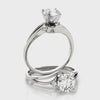 side views of the 14K white gold round lab diamond bypass ring.