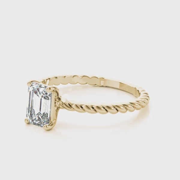 14K yellow gold lab grown emerald diamond ring showing twisted design