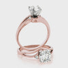 the elegant fluid curves of the 14K rose gold diamond wave ring.