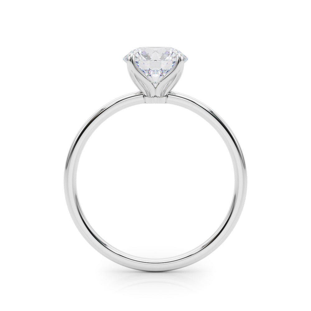 Front view of a 14K white gold round brilliant cut lab grown diamond solitaire ring on a white background.