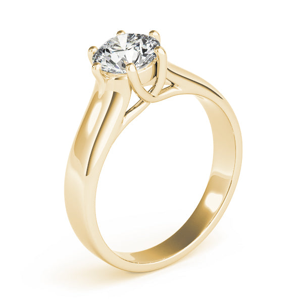 Detailed side view of the yellow gold ring highlighting the artistic designer gallery under the diamond.