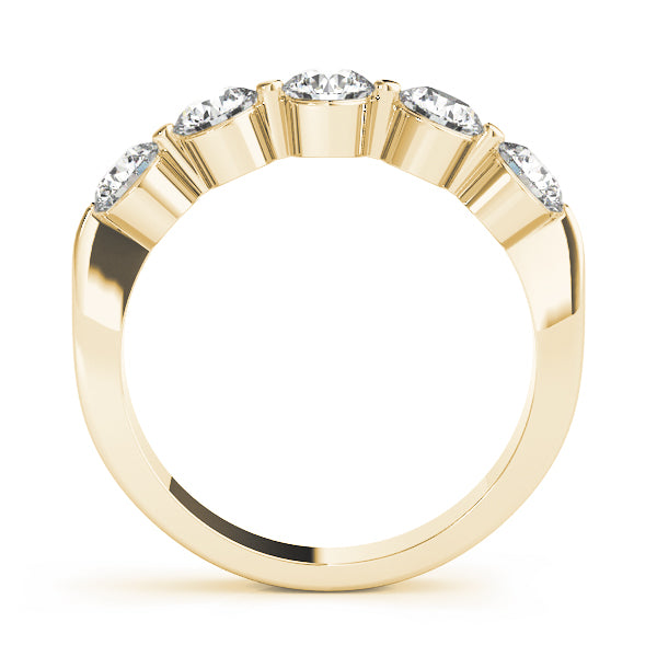 Close-up of shared prong setting in 14K yellow gold diamond ring
