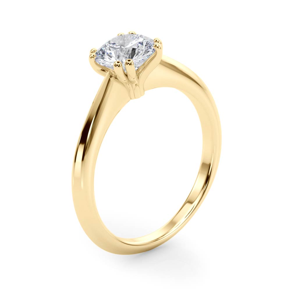 Side view highlighting the sleek band and double prong setting in yellow gold.